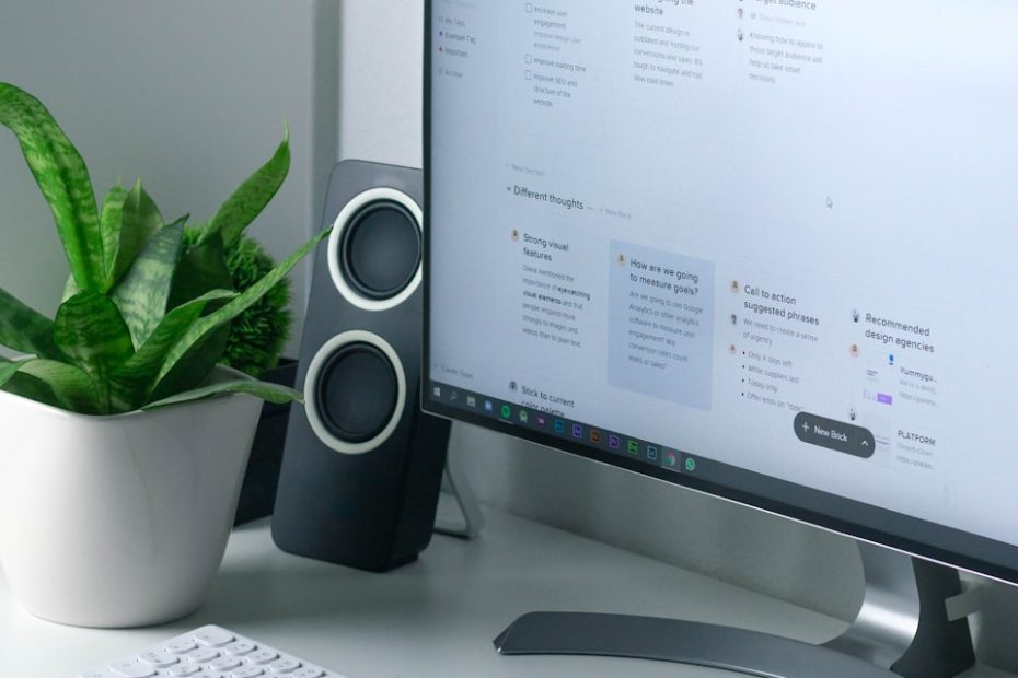 white computer monitor and white keyboard